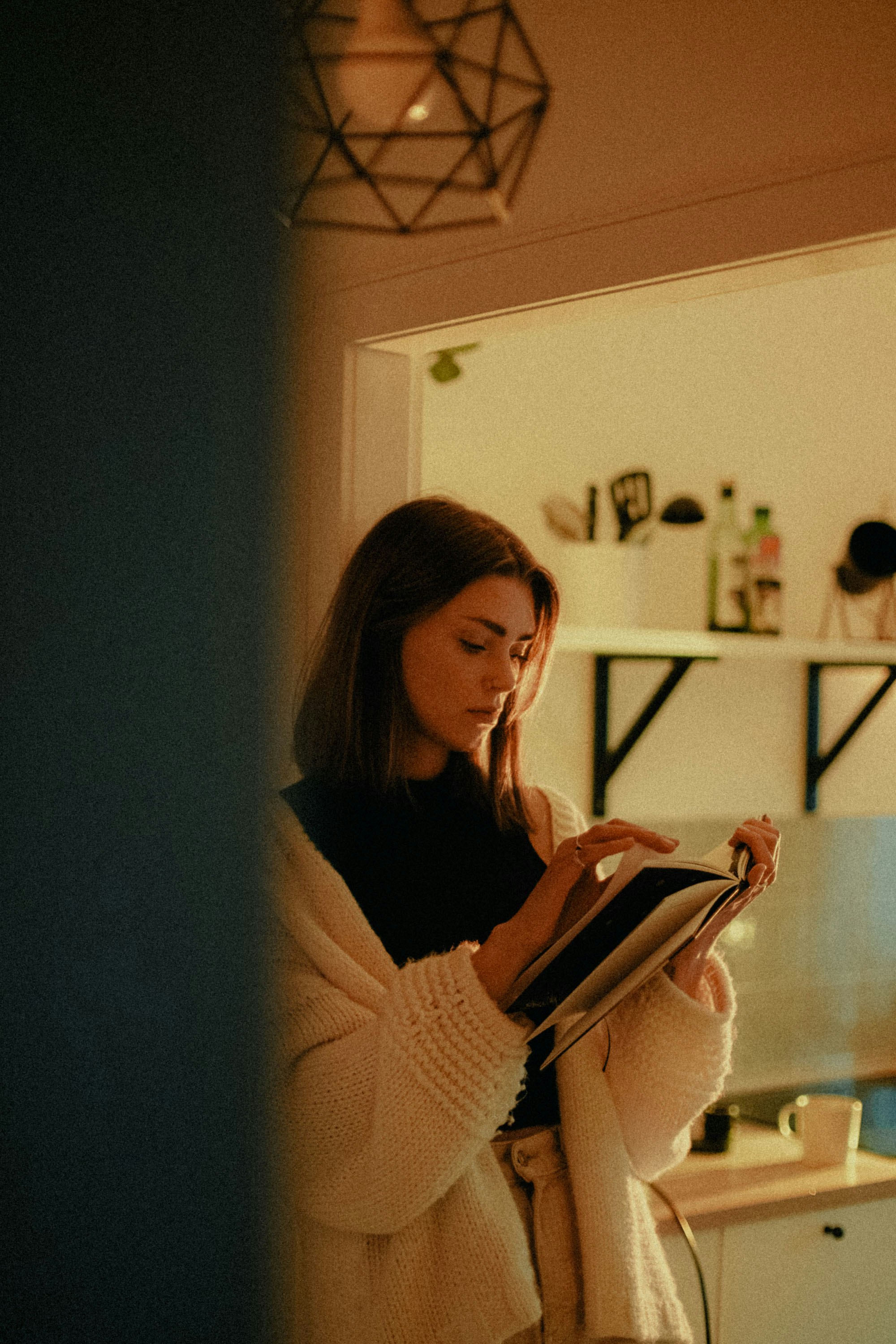 woman in black long sleeve shirt holding white tablet computer